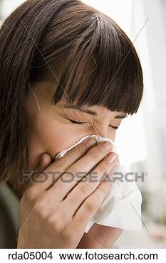 Stock Photo - woman blowing 
nose. fotosearch 
- search stock 
photos, pictures, 
images, and photo 
clipart