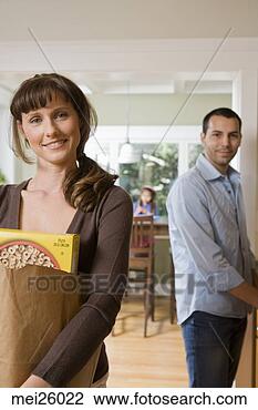 Stock Photo - woman carrying 
grocery bag. fotosearch 
- search stock 
photos, pictures, 
images, and photo 
clipart