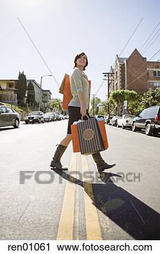 Stock Photography - woman carrying 
shopping bags. 
fotosearch - search 
stock photos, 
pictures, images, 
and photo clipart
