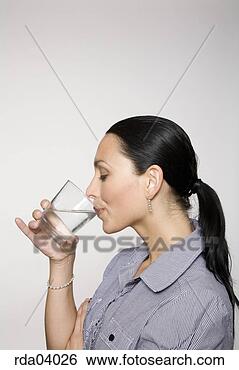 Stock Photo - woman drinking 
glass of water. 
fotosearch - search 
stock photos, 
pictures, images, 
and photo clipart