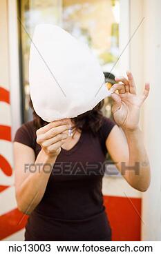 Stock Photo - woman eating cotton 
candy. fotosearch 
- search stock 
photos, pictures, 
images, and photo 
clipart