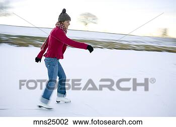 Stock Photo - woman ice-skating. 
fotosearch - search 
stock photos, 
pictures, images, 
and photo clipart