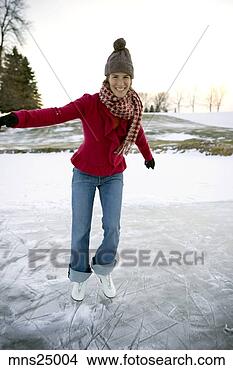 Stock Photo - woman ice-skating. 
fotosearch - search 
stock photos, 
pictures, images, 
and photo clipart
