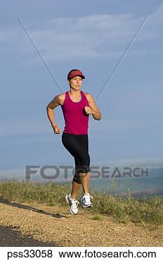 Stock Photo - woman jogging 
on roadside. fotosearch 
- search stock 
photos, pictures, 
images, and photo 
clipart