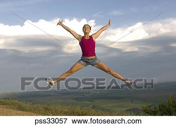 Picture - woman jumping 
in mid-air. fotosearch 
- search stock 
photos, pictures, 
images, and photo 
clipart