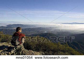 Stock Photo - woman on rock 
overlooking countryside. 
fotosearch - search 
stock photos, 
pictures, images, 
and photo clipart
