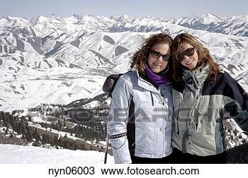 Stock Photo - women smiling 
on ski slopes. 
fotosearch - search 
stock photos, 
pictures, images, 
and photo clipart