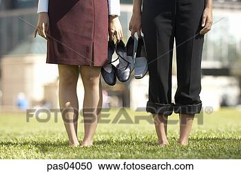 Stock Photography - women standing 
on lawn in bare 
feet. fotosearch 
- search stock 
photos, pictures, 
images, and photo 
clipart