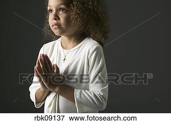 Picture - young african 
girl praying. 
fotosearch - search 
stock photos, 
pictures, images, 
and photo clipart