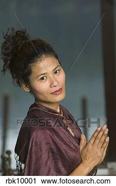 Stock Photography - young asian woman 
praying. fotosearch 
- search stock 
photos, pictures, 
images, and photo 
clipart