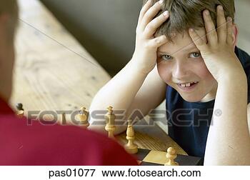 Picture - young boy losing 
at chess. fotosearch 
- search stock 
photos, pictures, 
images, and photo 
clipart