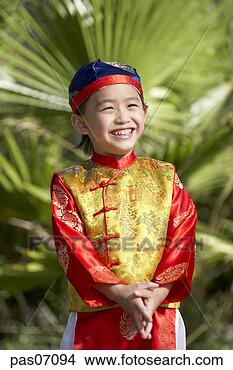 Stock Photo - young boy smiling 
in traditional 
clothing. fotosearch 
- search stock 
photos, pictures, 
images, and photo 
clipart
