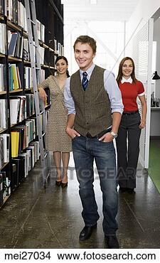 Stock Photo - young businesspeople 
next to bookshelves. 
fotosearch - search 
stock photos, 
pictures, images, 
and photo clipart