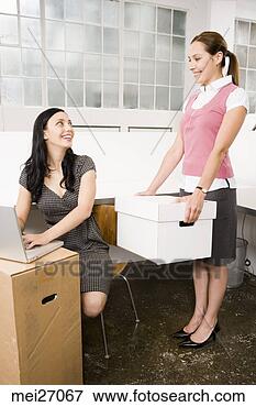 Picture - young businesswomen 
in new office. 
fotosearch - search 
stock photos, 
pictures, images, 
and photo clipart