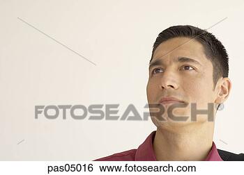 Stock Photo - young hispanic 
man looking up. 
fotosearch - search 
stock photos, 
pictures, images, 
and photo clipart