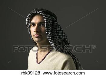 Stock Photo - young man wearing 
keffiyeh. fotosearch 
- search stock 
photos, pictures, 
images, and photo 
clipart