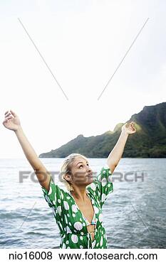 Stock Photo - young woman with 
arms raised. fotosearch 
- search stock 
photos, pictures, 
images, and photo 
clipart
