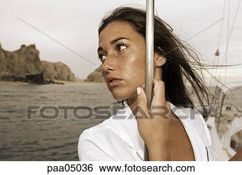 Stock Photo - young woman holding 
pole on sailboat. 
fotosearch - search 
stock photos, 
pictures, images, 
and photo clipart