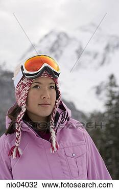 Stock Photo - young woman wearing 
hat and ski goggles. 
fotosearch - search 
stock photos, 
pictures, images, 
and photo clipart