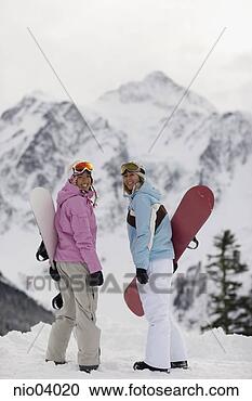 Stock Photography - young women holding 
snowboards. fotosearch 
- search stock 
photos, pictures, 
images, and photo 
clipart