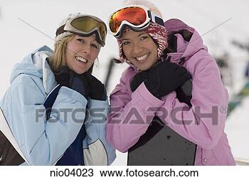 Stock Photo - young women holding 
snowboards. fotosearch 
- search stock 
photos, pictures, 
images, and photo 
clipart