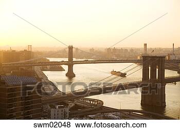 Stock Photo - aerial view of 
bridges spanning 
east river, new 
york city, new 
york. fotosearch 
- search stock 
photos, pictures, 
images, and photo 
clipart