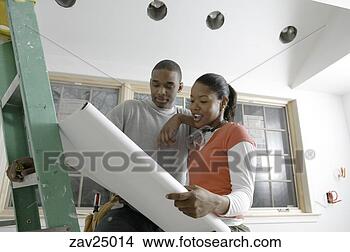 Stock Photo - african couple 
discussing plans 
for unfinished 
room. fotosearch 
- search stock 
photos, pictures, 
images, and photo 
clipart