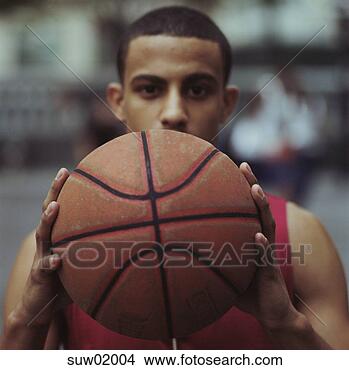 Stock Photo - african male basketball 
player holding 
ball. fotosearch 
- search stock 
photos, pictures, 
images, and photo 
clipart