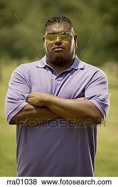 Stock Photo - african man with 
arms crossed. 
fotosearch - search 
stock photos, 
pictures, images, 
and photo clipart