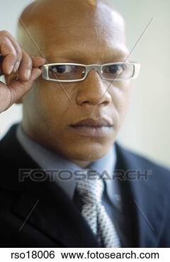 Stock Photo - african man in 
eyeglasses. fotosearch 
- search stock 
photos, pictures, 
images, and photo 
clipart