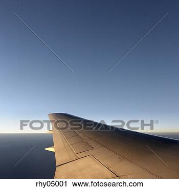 Stock Photography - airplane wing 
and horizon. fotosearch 
- search stock 
photos, pictures, 
images, and photo 
clipart
