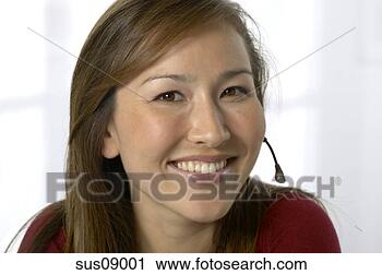 Stock Photography - asian businesswoman 
wearing headset. 
fotosearch - search 
stock photos, 
pictures, images, 
and photo clipart