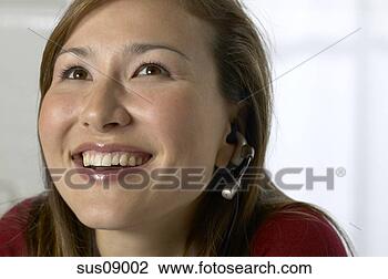 Stock Photo - asian businesswoman 
wearing headset. 
fotosearch - search 
stock photos, 
pictures, images, 
and photo clipart