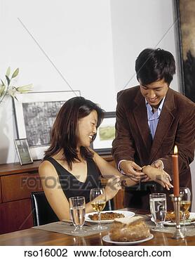 Stock Photo - asian man giving 
woman bracelet 
at dinner. fotosearch 
- search stock 
photos, pictures, 
images, and photo 
clipart
