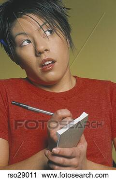 Stock Photography - asian waitress 
writing food order. 
fotosearch - search 
stock photos, 
pictures, images, 
and photo clipart