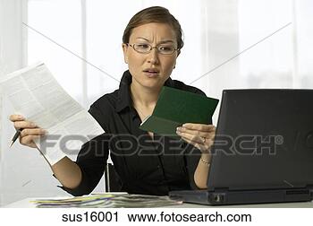 Stock Photography - asian woman paying 
bills. fotosearch 
- search stock 
photos, pictures, 
images, and photo 
clipart