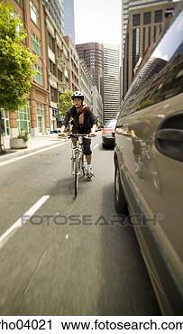 Stock Photography - bike messenger 
in traffic. fotosearch 
- search stock 
photos, pictures, 
images, and photo 
clipart