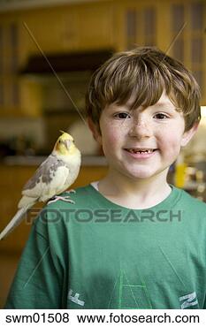 Stock Photo - boy with bird 
on shoulder. fotosearch 
- search stock 
photos, pictures, 
images, and photo 
clipart