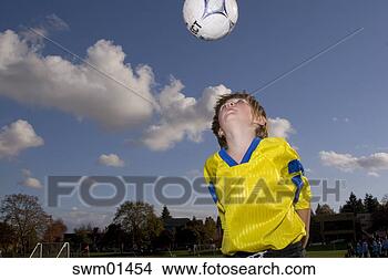 Stock Photo - boy bouncing soccer 
ball off head. 
fotosearch - search 
stock photos, 
pictures, images, 
and photo clipart