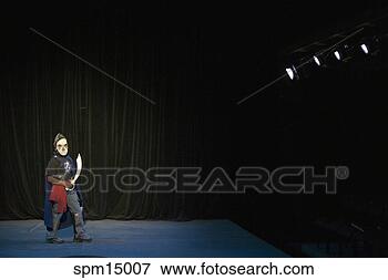 Picture - boy in knight 
costume on stage. 
fotosearch - search 
stock photos, 
pictures, images, 
and photo clipart