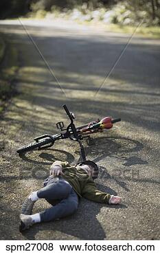 Stock Photo - boy lying on back 
in front of bicycle. 
fotosearch - search 
stock photos, 
pictures, images, 
and photo clipart