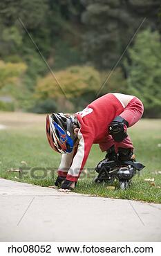 Stock Photo - boy in park on 
inline skates. 
fotosearch - search 
stock photos, 
pictures, images, 
and photo clipart