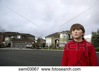 Picture - boy standing outdoors. 
fotosearch - search 
stock photos, 
pictures, images, 
and photo clipart