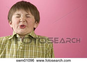 Stock Photo - boy wrinkling 
his nose. fotosearch 
- search stock 
photos, pictures, 
images, and photo 
clipart