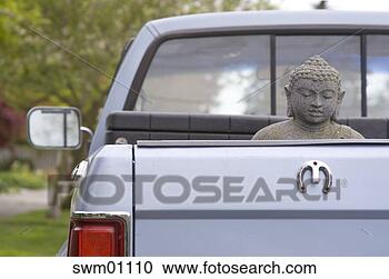 Stock Photography - buddha statue 
in back of pickup 
truck. fotosearch 
- search stock 
photos, pictures, 
images, and photo 
clipart