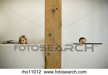 Stock Photo - business people 
working in cubicle. 
fotosearch - search 
stock photos, 
pictures, images, 
and photo clipart