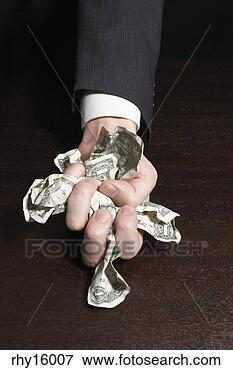 Picture - businessman crumpling 
money in fist. 
fotosearch - search 
stock photos, 
pictures, images, 
and photo clipart