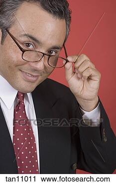 Stock Photography - businessman looking 
over eyeglasses. 
fotosearch - search 
stock photos, 
pictures, images, 
and photo clipart