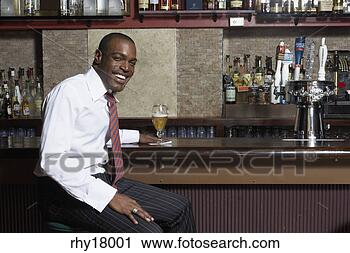 Stock Photography - businessman sitting 
at bar. fotosearch 
- search stock 
photos, pictures, 
images, and photo 
clipart