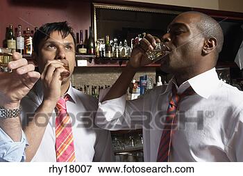 Picture - businessmen having 
shots in bar. 
fotosearch - search 
stock photos, 
pictures, images, 
and photo clipart